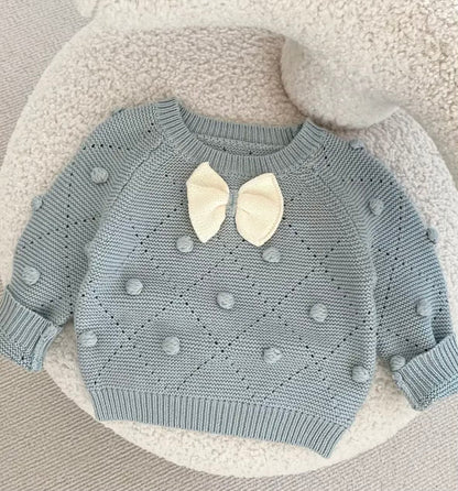 BLUE KNITTED SWEATER WITH A BOW