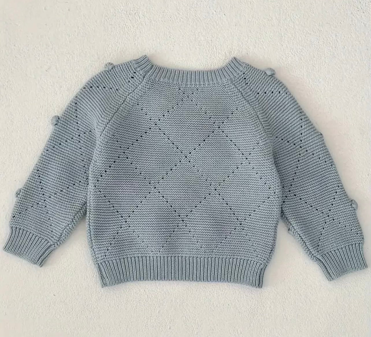 BLUE KNITTED SWEATER WITH A BOW